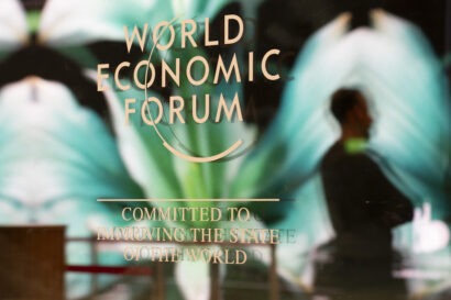A sign that reads: World Economic Forum, Committed to Improving the State of the World