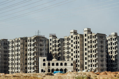Wide shot of a series of 6 apartments complexes that are under construction in Islamabad, Pakistan