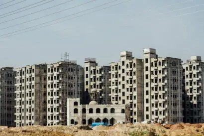 Wide shot of a series of 6 apartments complexes that are under construction in Islamabad, Pakistan
