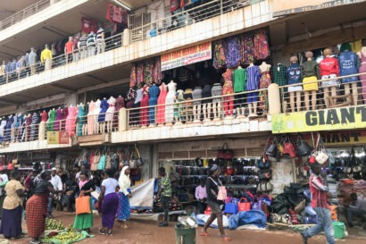 A three-floor building of clothing shops in a market