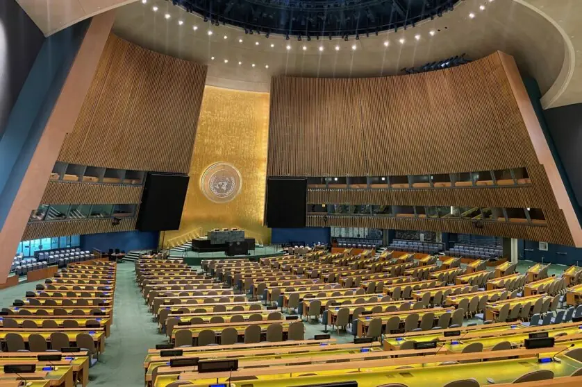 Large convening hall with the UN logo at the front